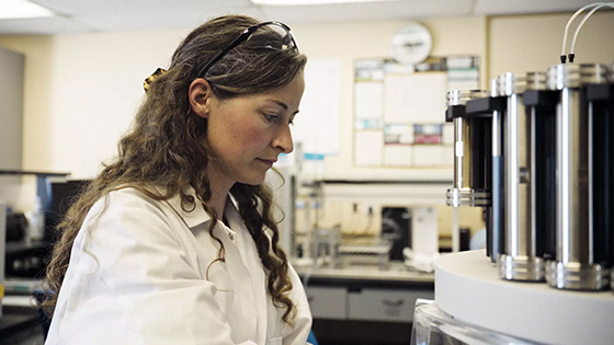 female researcher prepares chemical analysis in lab