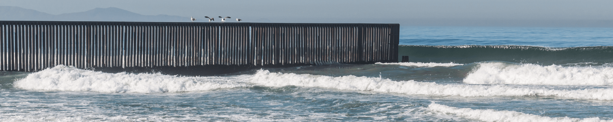 border fence in ocean between imperial beach and tijuana